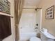 Cozy bathroom with tub, shower, and neutral colored walls at 2710 Mustang Pass St, Laughlin, NV 89029