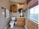 Comfortable bathroom vanity with brown wood color cabinet and a decor at 2710 Mustang Pass St, Laughlin, NV 89029