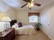 Inviting bedroom featuring neutral walls, ceiling fan, a twin bed, and comfortable furnishings at 2710 Mustang Pass St, Laughlin, NV 89029