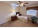 Cozy bedroom featuring neutral walls, ceiling fan, a twin bed, and comfortable furnishings at 2710 Mustang Pass St, Laughlin, NV 89029