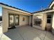 Charming courtyard with a fireplace and glass doors for seamless indoor-outdoor living at 2710 Mustang Pass St, Laughlin, NV 89029