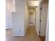 Hallway with neutral walls and tile flooring, connecting various rooms in the house at 2710 Mustang Pass St, Laughlin, NV 89029