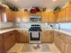 Kitchen featuring wooden cabinets and stainless steel appliances at 2710 Mustang Pass St, Laughlin, NV 89029