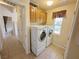 Laundry room with stacked washer and dryer, neutral walls, offering functionality and convenience at 2710 Mustang Pass St, Laughlin, NV 89029