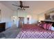 Spacious main bedroom with ceiling fan, dresser and decorative furnishings at 2710 Mustang Pass St, Laughlin, NV 89029