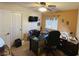 Well-lit office with ceiling fan and mounted TV, providing comfortable workspace at 2710 Mustang Pass St, Laughlin, NV 89029