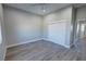 Spacious bedroom with gray vinyl flooring and double doors at 2750 Zephyr Ave, Pahrump, NV 89048