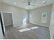 Bright bedroom featuring wood-look floors and ample closet space at 2750 Zephyr Ave, Pahrump, NV 89048