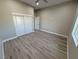 Bright bedroom with double closets and wood-look floors at 2750 Zephyr Ave, Pahrump, NV 89048