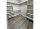 Large walk-in closet with custom shelving and hanging rods at 2750 Zephyr Ave, Pahrump, NV 89048