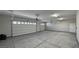 Large three-car garage with epoxy floor and overhead storage at 2750 Zephyr Ave, Pahrump, NV 89048