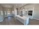 Modern kitchen with white cabinets and large island at 2750 Zephyr Ave, Pahrump, NV 89048