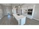 Modern kitchen with white cabinets, quartz countertops, and stainless steel appliances at 2750 Zephyr Ave, Pahrump, NV 89048