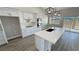 Modern kitchen with white cabinets, quartz countertops, and stainless steel appliances at 2750 Zephyr Ave, Pahrump, NV 89048