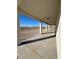 Long covered patio with ceiling fans at 2750 Zephyr Ave, Pahrump, NV 89048