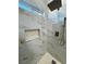 Walk-in shower with marble tile and niche at 2750 Zephyr Ave, Pahrump, NV 89048