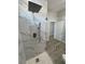 Large walk-in shower with marble tile and rainfall shower head at 2750 Zephyr Ave, Pahrump, NV 89048