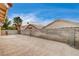 Expansive brick-paved backyard, showcasing privacy walls and a glimpse of the neighborhood at 5217 Yellow Dawn Ct, Las Vegas, NV 89130