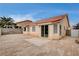 Paver patio and rear house view showcases the home's windows, door, and tile roof at 5217 Yellow Dawn Ct, Las Vegas, NV 89130