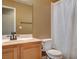 Bathroom with a shower, sink, mirror, toilet, and neutral colored paint at 5217 Yellow Dawn Ct, Las Vegas, NV 89130