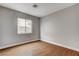 Bedroom featuring vinyl floor, baseboards, one window, and neutral paint at 5217 Yellow Dawn Ct, Las Vegas, NV 89130