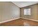 Bedroom featuring vinyl floor, baseboards, neutral paint, and one window at 5217 Yellow Dawn Ct, Las Vegas, NV 89130