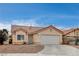 Inviting single-story home featuring desert landscaping, a two-car garage, and a well-maintained exterior at 5217 Yellow Dawn Ct, Las Vegas, NV 89130