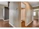 Hallway leading to a bathroom with vinyl floors and neutral colored paint at 5217 Yellow Dawn Ct, Las Vegas, NV 89130