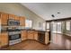 Well-lit kitchen with stainless steel appliances and an adjacent dining area at 5217 Yellow Dawn Ct, Las Vegas, NV 89130