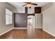 Spacious living room with wood floors, neutral paint, high ceilings, and an open doorway at 5217 Yellow Dawn Ct, Las Vegas, NV 89130