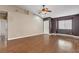 Bright living room with wood floors, a ceiling fan, neutral paint, and lots of natural light at 5217 Yellow Dawn Ct, Las Vegas, NV 89130