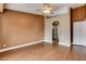 Spacious main bedroom with an ensuite bathroom, ceiling fan and wood-look flooring at 5217 Yellow Dawn Ct, Las Vegas, NV 89130