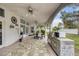 Covered patio with outdoor kitchen, dining area, and ceiling fan at 808 Hillgrove Ct, Las Vegas, NV 89145