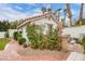 White storage shed with a red tile roof at 808 Hillgrove Ct, Las Vegas, NV 89145