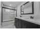 Bathroom with double vanity and black cabinets at 303 Vallarte Dr, Henderson, NV 89014