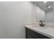 Modern bathroom with a sleek vanity and quartz countertop at 303 Vallarte Dr, Henderson, NV 89014