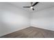 Simple bedroom with ceiling fan and carpet flooring at 303 Vallarte Dr, Henderson, NV 89014