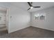 Spacious bedroom with ceiling fan and carpet flooring at 303 Vallarte Dr, Henderson, NV 89014