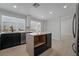 Open concept kitchen with island and stainless steel appliances at 303 Vallarte Dr, Henderson, NV 89014