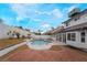 Inviting kidney-shaped pool with ample patio space at 303 Vallarte Dr, Henderson, NV 89014