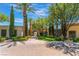 Mediterranean-style community building with lush landscaping at 4414 Regalo Bello St, Las Vegas, NV 89135