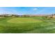 Expansive green golf course with a sand trap at 4414 Regalo Bello St, Las Vegas, NV 89135