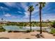 Peaceful lake view with palm trees and golf course in background at 4414 Regalo Bello St, Las Vegas, NV 89135