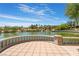 Serene lake view with a stone patio and seating area at 4414 Regalo Bello St, Las Vegas, NV 89135