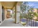 Second-story balcony with wrought iron railing and arched details offering neighborhood views at 7579 Harwich Bay Ave, Las Vegas, NV 89179