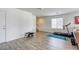 Bonus room featuring laminate flooring, a window, and access to the staircase at 7579 Harwich Bay Ave, Las Vegas, NV 89179