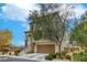 This two-story home features stairs to the entry, stone accents, and a two-car garage at 7579 Harwich Bay Ave, Las Vegas, NV 89179