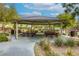 Community gazebo featuring picnic tables for outdoor gatherings in a landscaped common area at 7579 Harwich Bay Ave, Las Vegas, NV 89179