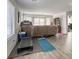 Spacious living room with wood floors and lots of natural light from the sliding glass door at 7579 Harwich Bay Ave, Las Vegas, NV 89179