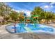 Colorful splash pad with various water features and seating for relaxing, set in a park at 7579 Harwich Bay Ave, Las Vegas, NV 89179